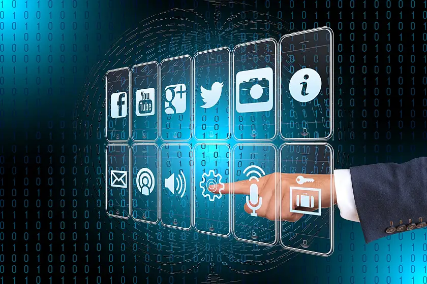 Zeigefinger zeigt auf Icons auf dem Computerbildschirm